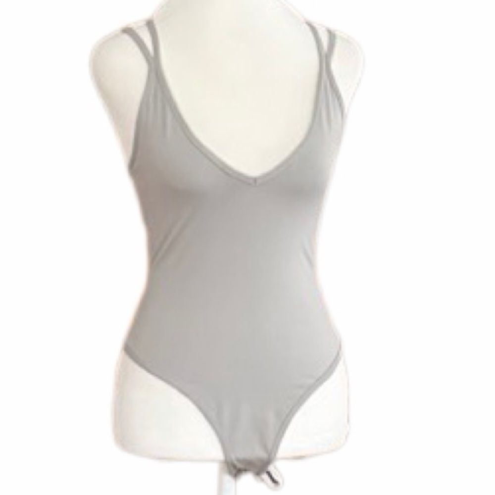 New with tag Capella lightweight gray strappy bodysuit size Large.